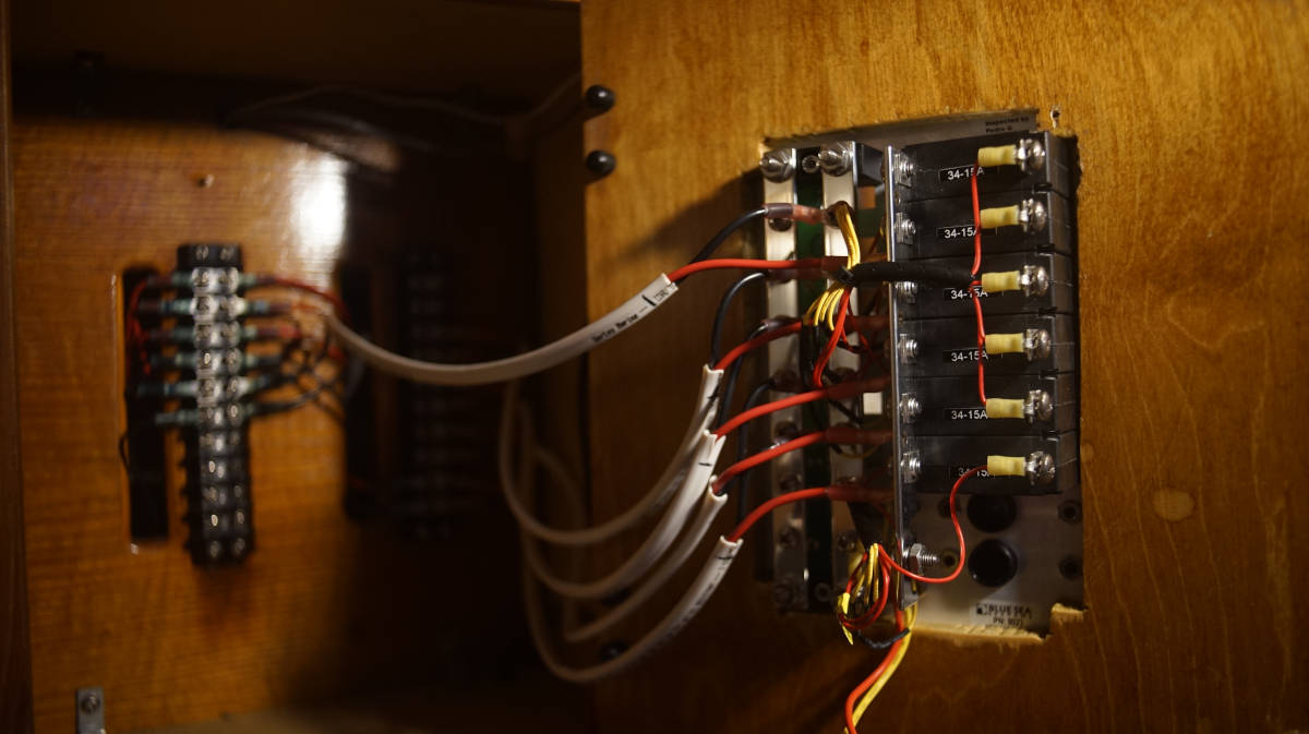 the finished breaker panel door connected with a view of the inside