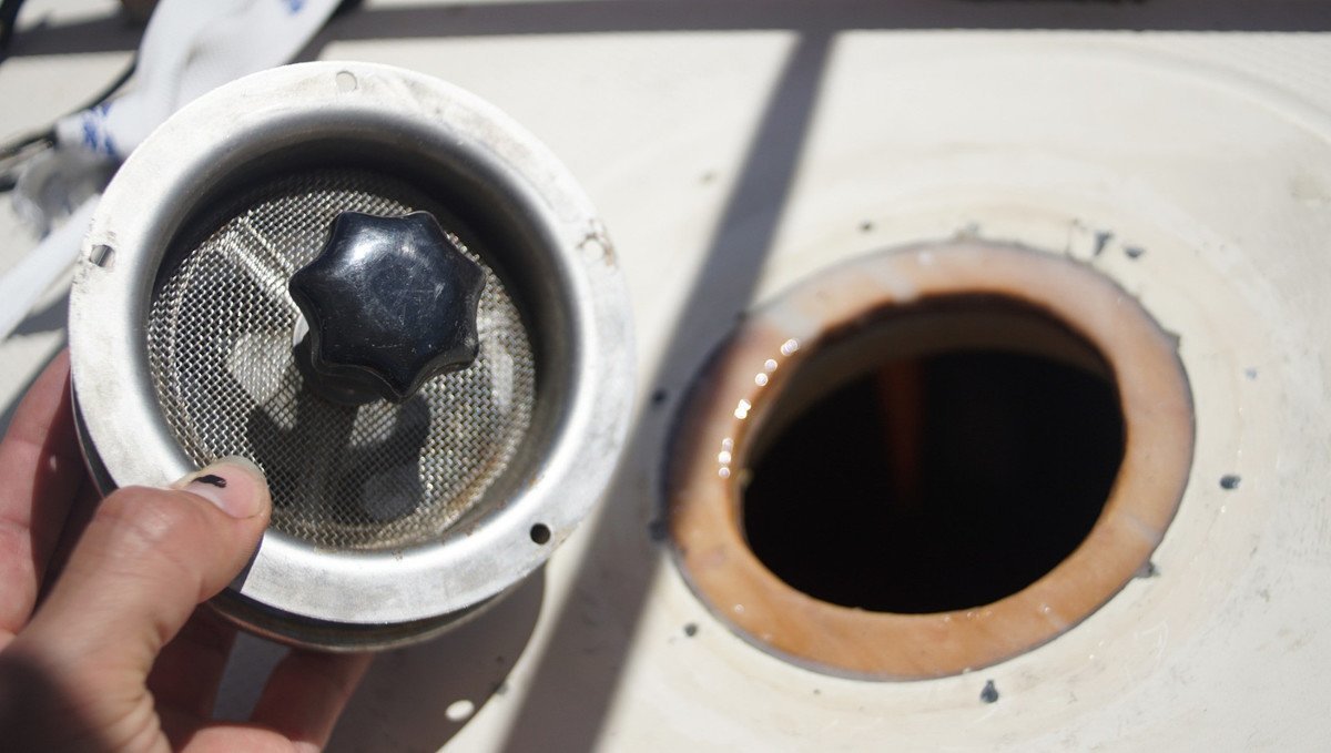 new hole in the deck in the background, underside of the new-to-us vetus mushroom vent in foreground