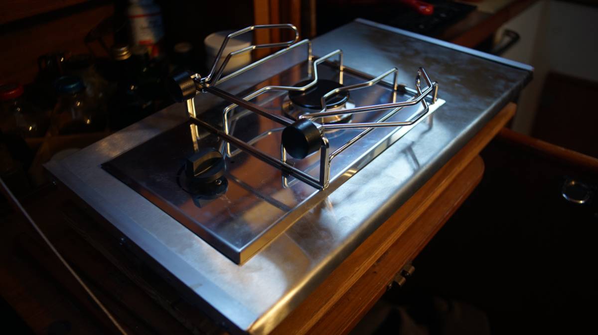the single lpg burner sitting on the stainless steel-wrapped platform, not yet bolted in