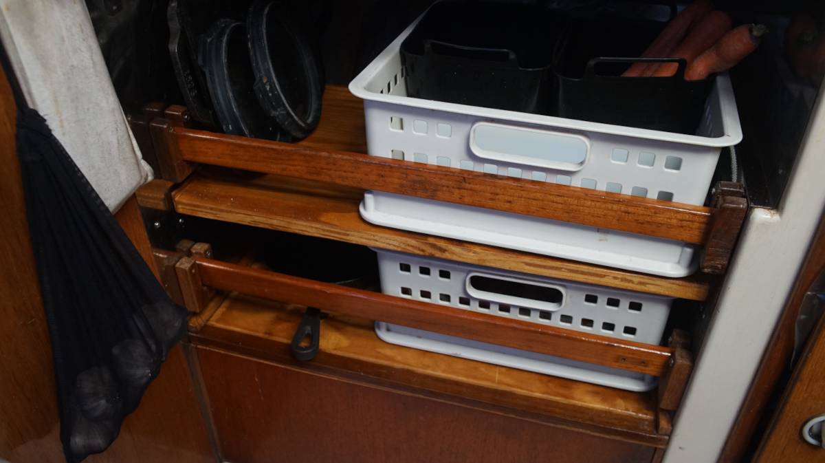 the baskets of produce sitting on their respective shelves in our new galley