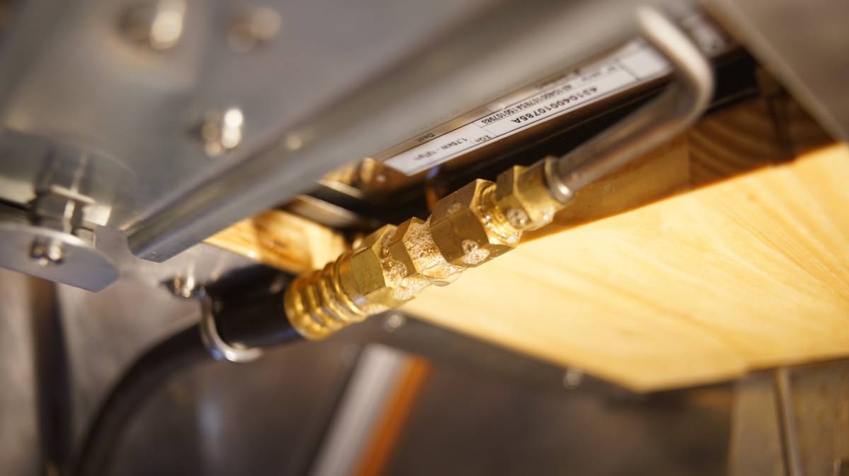 the lpg fittings under the stove covered in a thin layer of soapy water