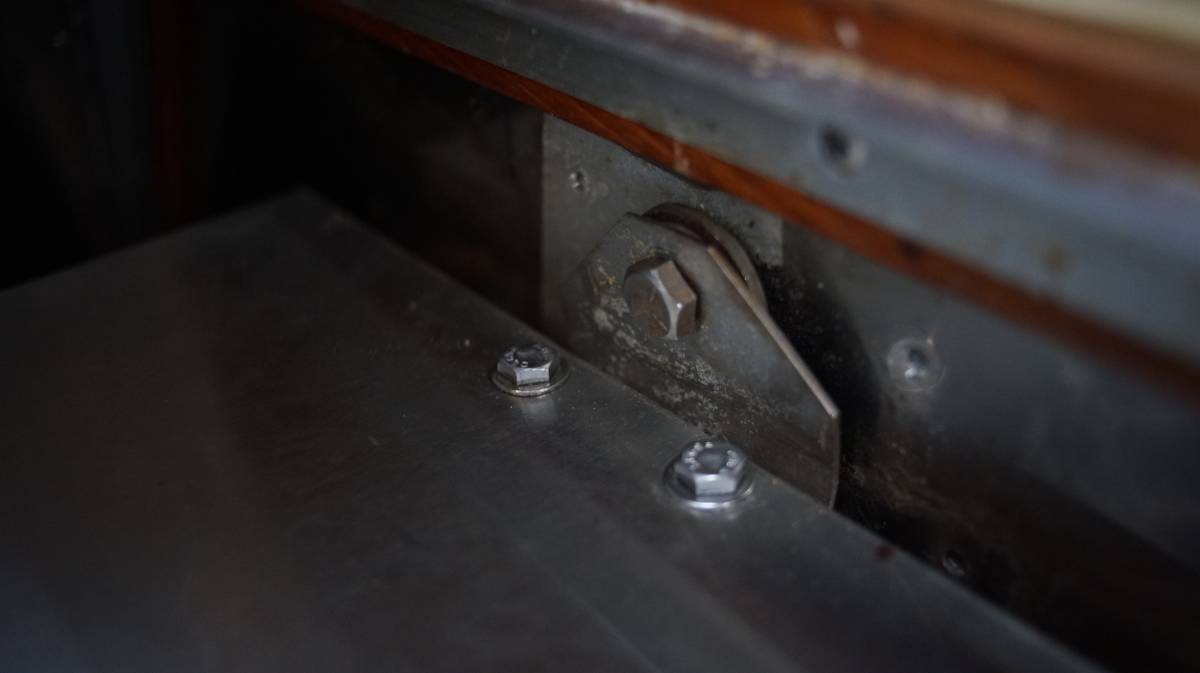 a photo of the heavy duty stainless steel brackets installed on the wall using a hex bolt