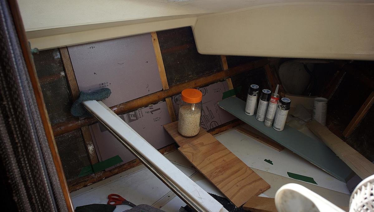 a photo of a variety of objects pressed onto glue foamb boards to help secure the foam to the wall