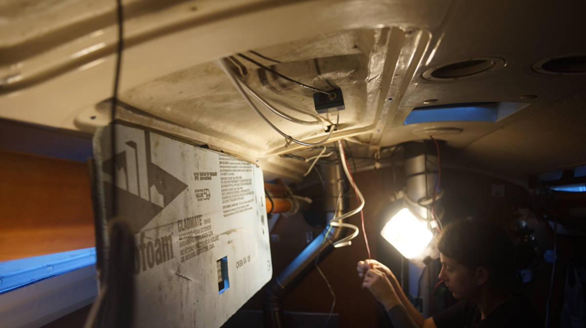 pinos cabin with all the ceiling panels hanging open, full of loose wiring