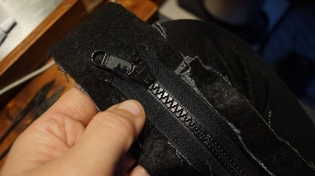 the zipper slide being inserted in the teeth