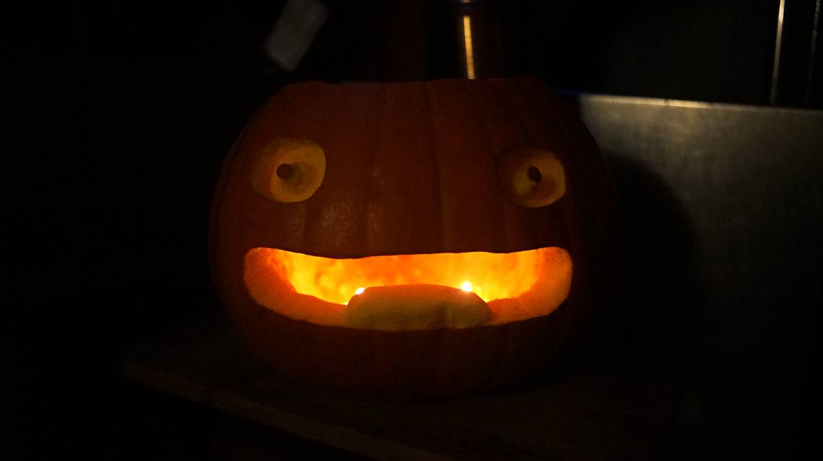 A photo of calcifers face carved onto a pumpkin