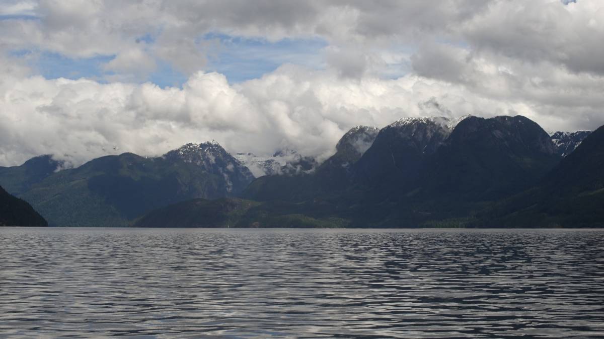 sheltered waters with a picturesque background of snowy mountains
