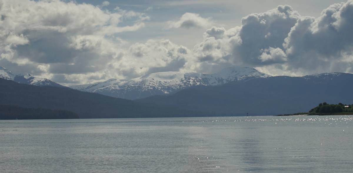 some far away snowy mountains on a sunny day
