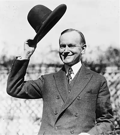 U.S. President Calvin Coolidge, tipping his hat. The hat was the special headpiece of the Smoki Indians of Prescott, Arizona. It had a rim of brilliant red and a crown of bright blue. The Smoki Indians were a fictitious tribe created in imitation of the local Hopi Indians that performed at Prescott's annual rodeo. The president was inducted into the Smoki tribe on the grounds of the White House on October 22, 1924. On June 2, 1924, President Coolidge had signed a bill granting Indians full U.S. citizenship. (Wikimedia Commons)