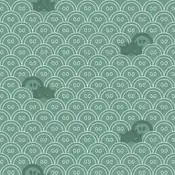 "Qwilfish conceals its pine green body and round tail fin among the wave crest pattern with similar markings to the ones on its tail fin."