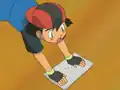 Ash wearing his second hat backwards
