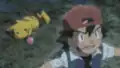 Ash wearing his I Choose You!, The Power of Us, and Secrets of the Jungle hat backwards