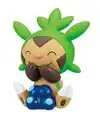 A figure of a Chespin with a stack of Oran Berries.