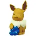 A figure of an Eevee with a stack of Oran Berries.