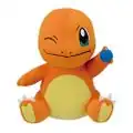 A plush toy of a Charmander holding an Oran Berry.