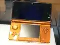 A Faded Orange Nintendo 3DS (never released)
