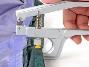 How to Install a Plastic Snap With a Handheld Tool