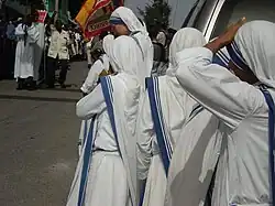 Missionaries of Charity wearing the traditional Sari during a religious procession in the streets of Port-au-Prince, Haiti, on the occasion of the feast of Saint Perpetua.