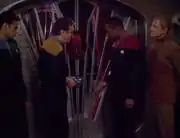 Bashir, O'Brien, Sisko, and Odo in front of Quark's