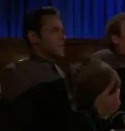 Bashir holding coonskin cap