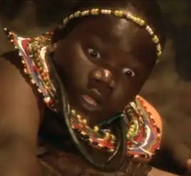 ... as a Masai boy in a flashback