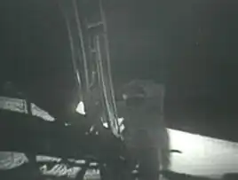 Buzz Aldrin taking his first step on the moon