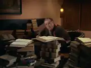 Cogley surrounded by books