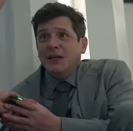 ...as the Grey-suited man