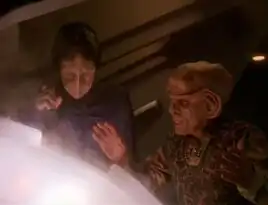 Hanok and Quark work together to defuse a Jem'Hadar torpedo