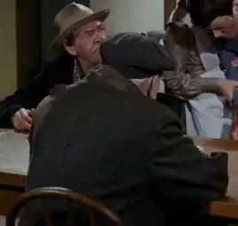 ...as a Homeless man (left)