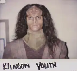 John on a makeup continuity polaroid