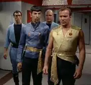 Spock and James T. Kirk with guards in 2267.