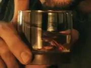 Kyheem drinking Kwejian whiskey