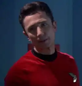 Malcolm Reed wearing a Starfleet uniform from the future