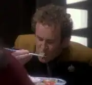 O'Brien eating with chopsticks