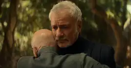 Picard and Q hug