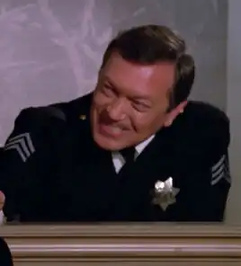 ... as a desk sergeant in TNG: "The Big Goodbye"