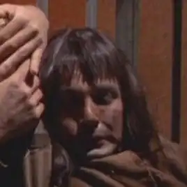 ...as an unnamed jailer