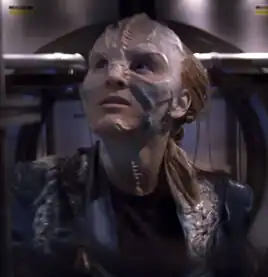 A Tarkalean female, partially assimilated