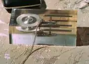 USS Enterprise metal model trapped in crystal