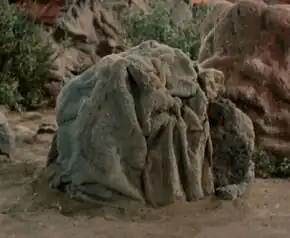 In the form of a rock