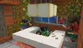Sunny and Noor are inspecting a collection of spawn eggs. A cartographer villager can also been seen peaking in through the window.
