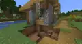 A house that was damaged by a creeper explosion. You can fix the house.