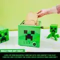 A toaster in the shape of a creeper.
