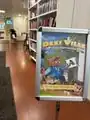 Sign promoting Dexi Ville at Kungsholmens Internationella Bibliotek.[8]
