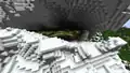 An exposed lush cave in the jagged peaks biome.