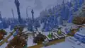 A village reaching into an ice spikes biome during snowfall.