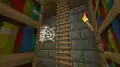 A ladder in a stronghold library, which gives a player access to a second floor