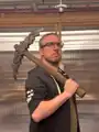 Marc Watson holding a prop of the pickaxe.