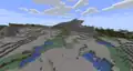 Gravel floating in midair in a windswept gravelly hills biome.